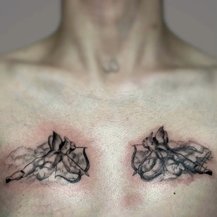 Matching cherubs with bows and clouds tattooed across the chest